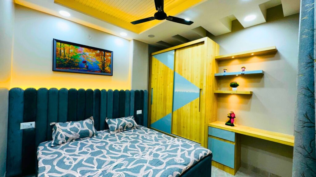 Modern bedroom with bed, wardrobe, and desk